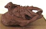 Terracotta clay sculpture of a bird on a branch